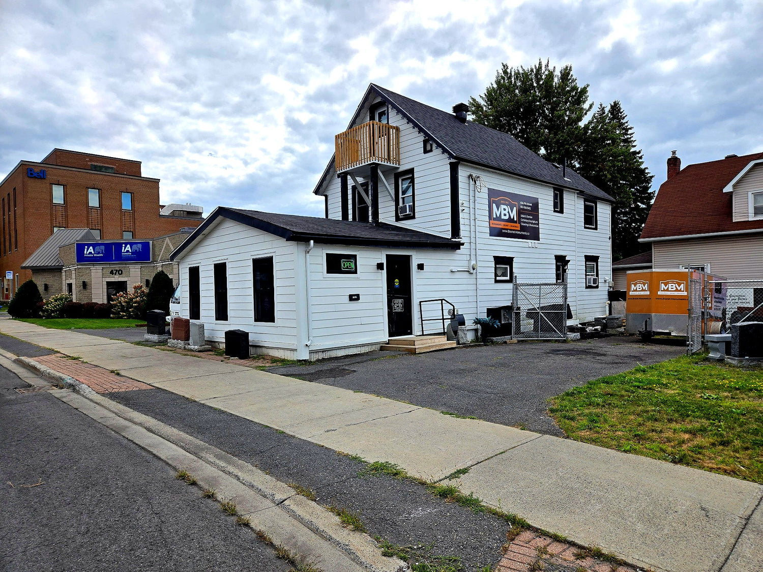 Headstones in front of Brunet Monuments in Cornwall. Fifth and Pitt Street